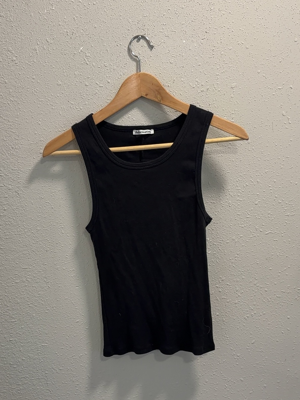 Reformation black tank top open in the back size medium